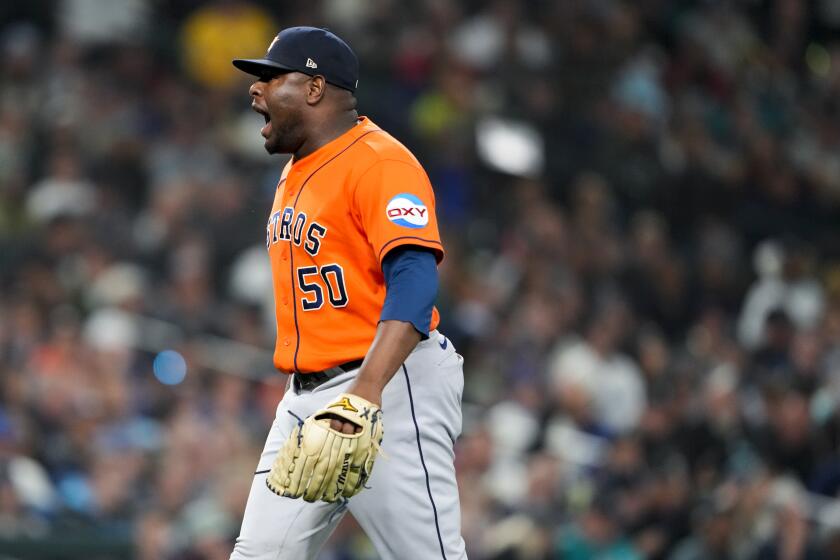 Houston Astros relief pitcher Hector Neris yells after striking out Seattle Mariners' Julio Rodriguez to end the sixth inning of a baseball game Wednesday, Sept. 27, 2023, in Seattle. (AP Photo/Lindsey Wasson)