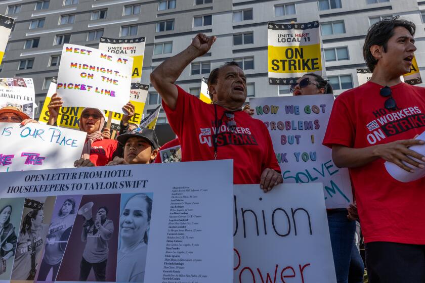 LOS ANGELES, CA - JULY 27: Striking hotel housekeepers calling on Taylor Swift to support their fight for a wage that enables them to afford to live, rally on Thursday, July 27, 2023 at Hyatt Regency LAX in Los Angeles, CA. (Irfan Khan / Los Angeles Times)