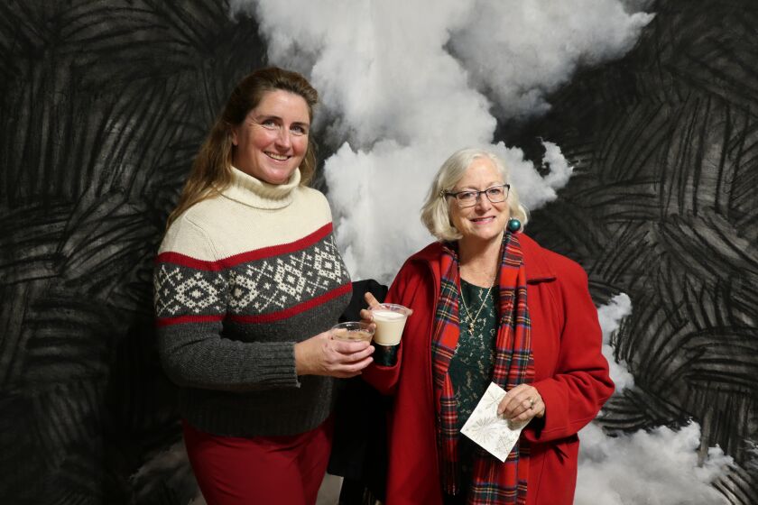 Mary Bush, Happy Scanlon Moore and the Athenaeum Music & Arts Library are decked out for the holidays Dec. 11.