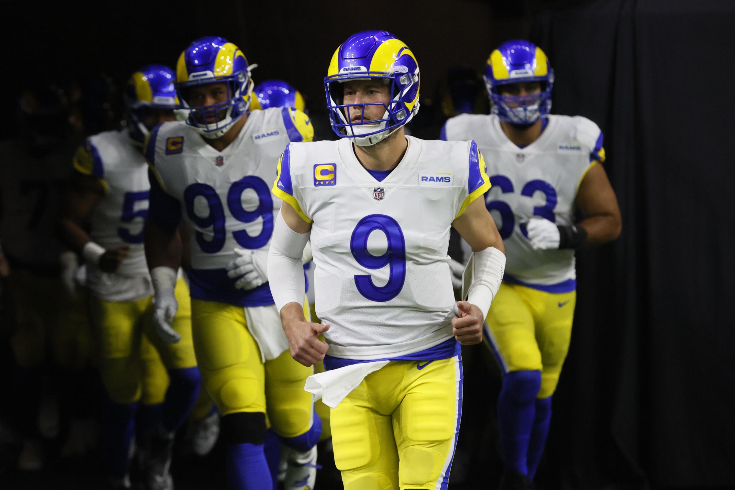 Rams quarterback Matthew Stafford leads his teammates onto the field before a loss to the New Orleans Saints.