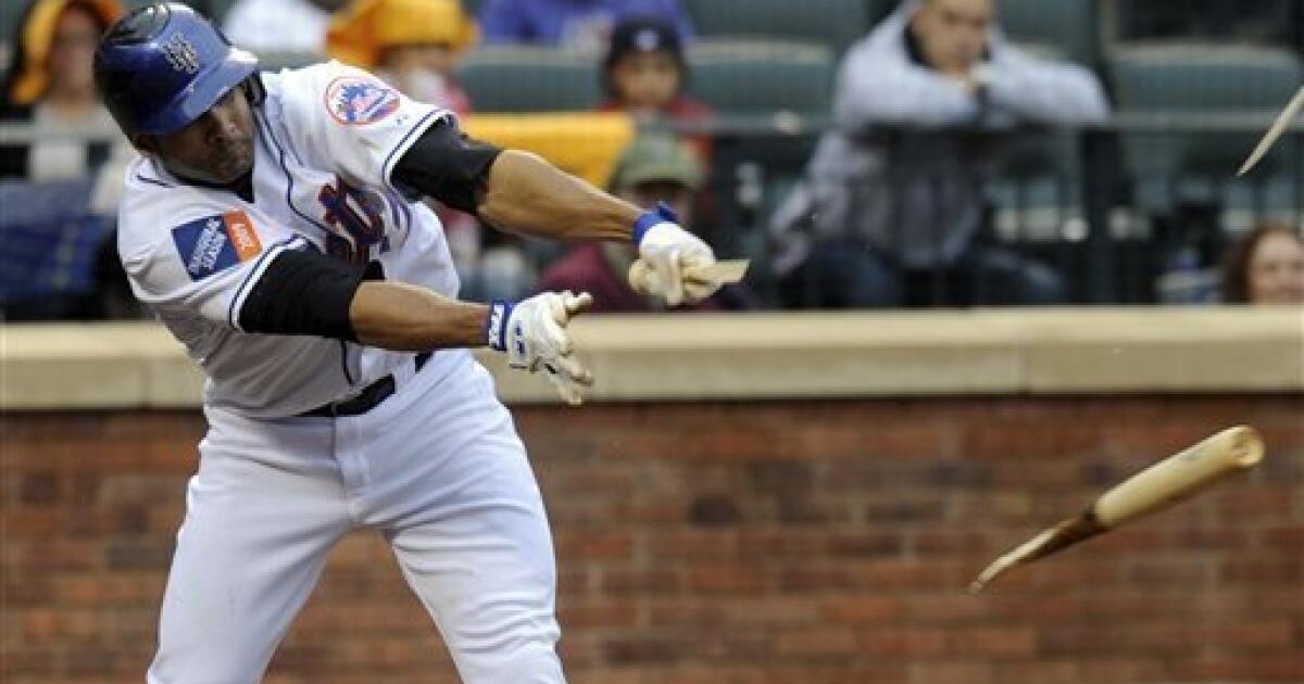 New York's centerfielder Carlos Beltran drives the ball to the