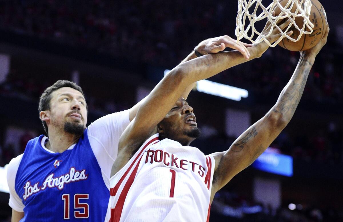 Clippers forward Hedo Turkoglu fouls Rockets forward Trevor Ariza as he tries to score in Game 2.