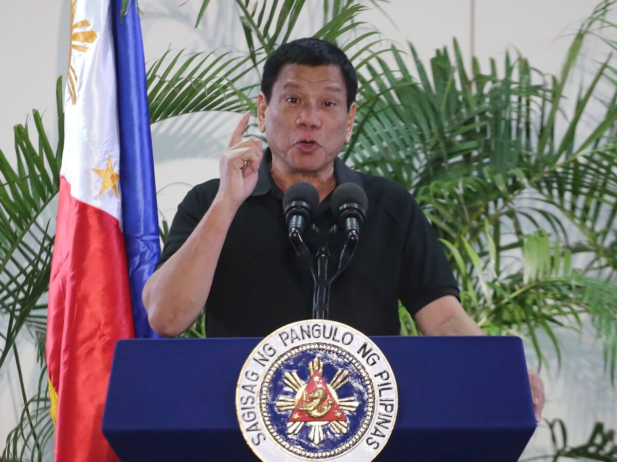 Philippines President Rodrigo Duterte delivers a speech at the Davao international airport terminal building early on Sept. 30.