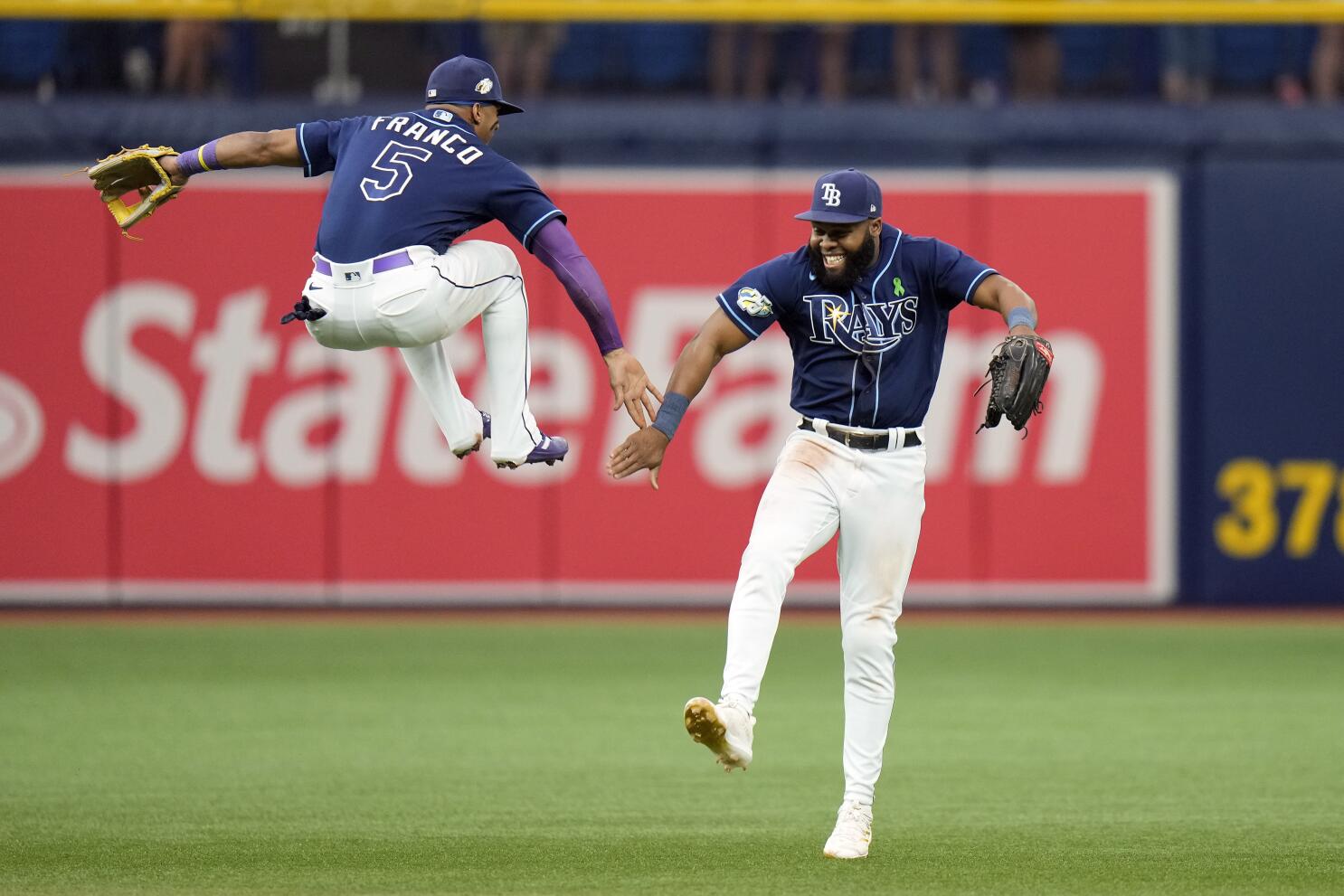 Texas Rangers shortstop Elvis Andrus (1) leaps over Houston Astros