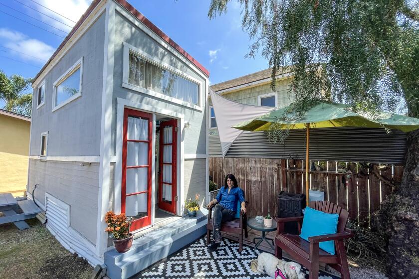 A two-story tiny house can be found in the backyard of San Diego resident Daria VanNice. It has two sleeping lofts.