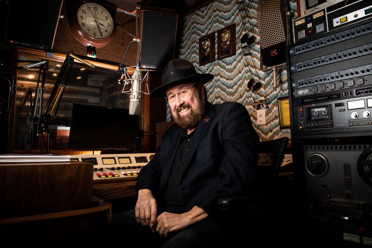 Radio personality "Shotgun Tom Kelly" poses for a portrait at his home studio.
