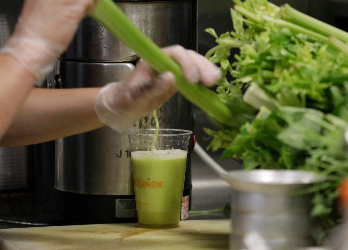 Celery juice being made at the Tonic Bar inside Erewhon Market in Los Angeles.
