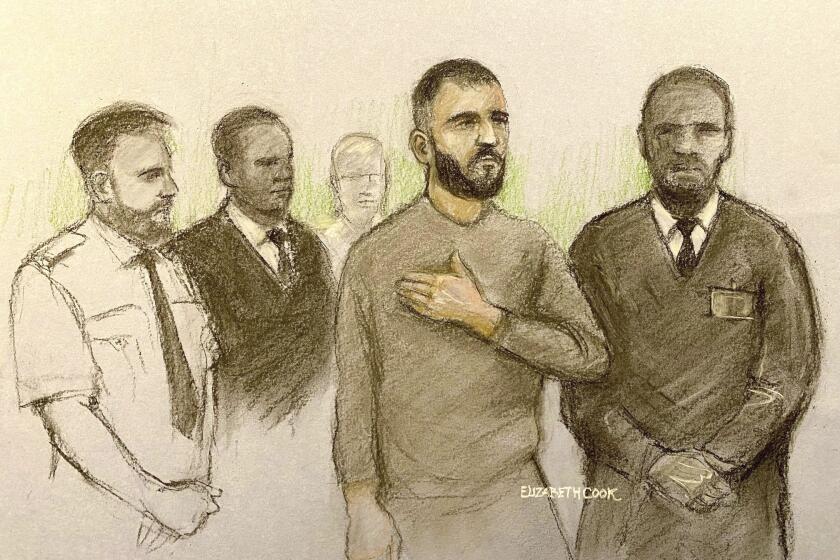This court artist sketch by Elizabeth Cook shows Marcus Arduini Monzo appearing at Westminster Magistrates' Court in London, Thursday May 2, 2024. Monzo, accused of brandishing a sword in a rampage in London that killed a teenage boy, severely injured two police officers and wounded two men appeared in court Thursday to face charges of murder and attempted murder. (Elizabeth Cook/PA via AP)