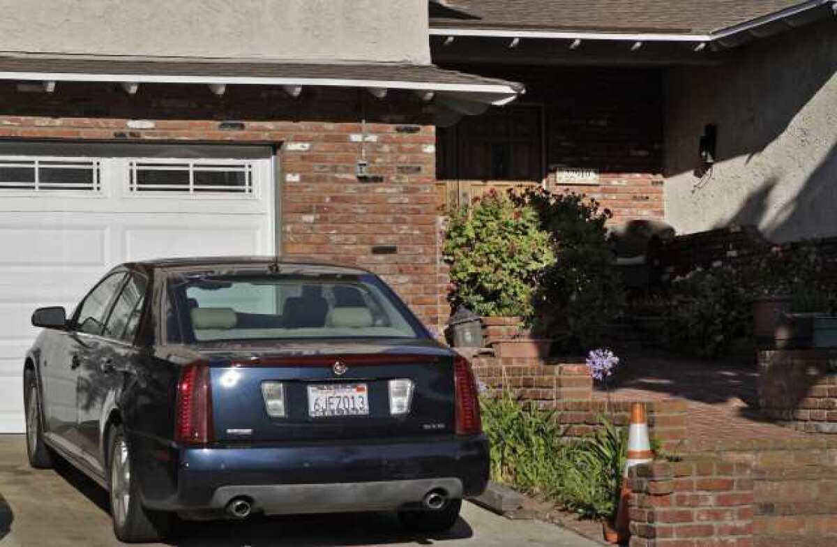 The 2005 Cadillac is parked at Patrick Lynch's home. The registration was put in his name in 2009.