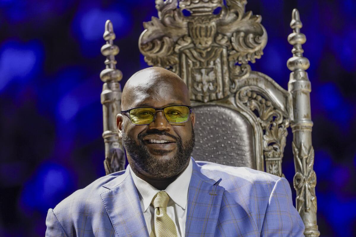 Shaquille O'Neal sits in a throne as his Orlando Magic jersey is retired Feb. 13 at Kia Center.