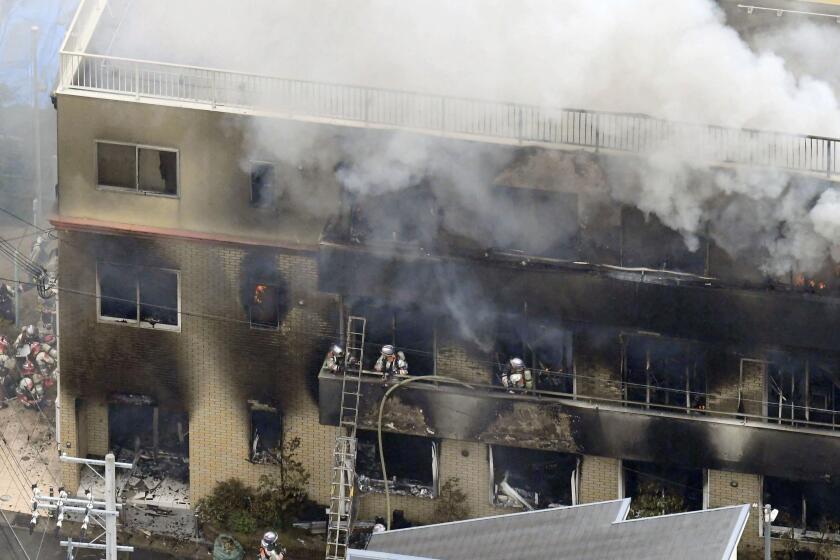 Firefighters respond to a building fire of Kyoto Animation in Kyoto, western Japan.