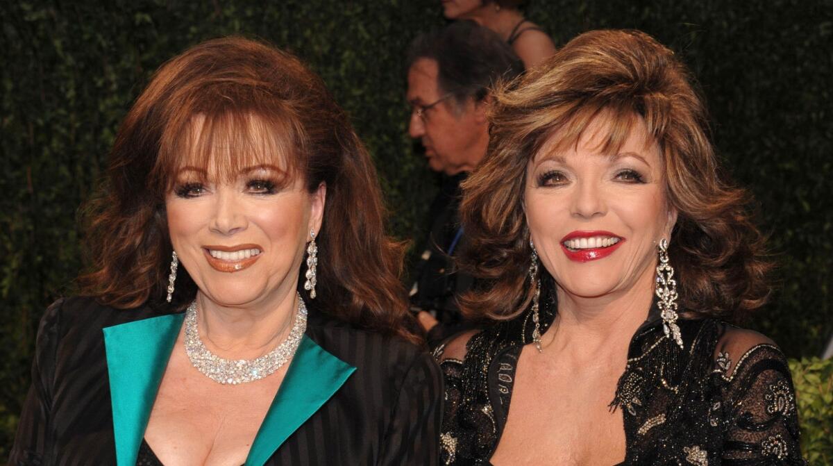 Joan Collins, right, poses with her sister, author Jackie Collins at the Vanity Fair Oscar party in 2009.