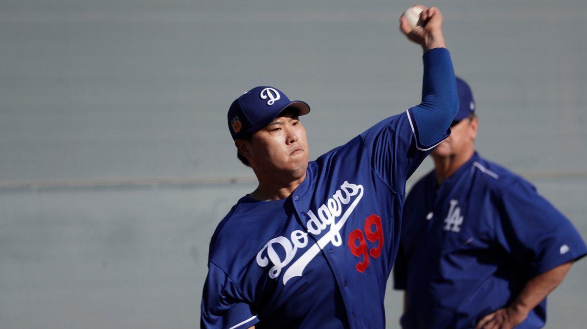 The Dodgers' Hyun-Jin Ryu throws during a spring training workout in Glendale, Ariz., on Feb. 14.