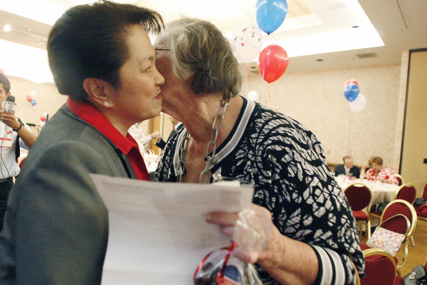 Former Glendale zoning administrator Edith Fuentes, left, receives a kiss from Joyce Ayvazi during her campaign kickoff for city council at Hilton in Glendale on Thursday, September 20, 2012.