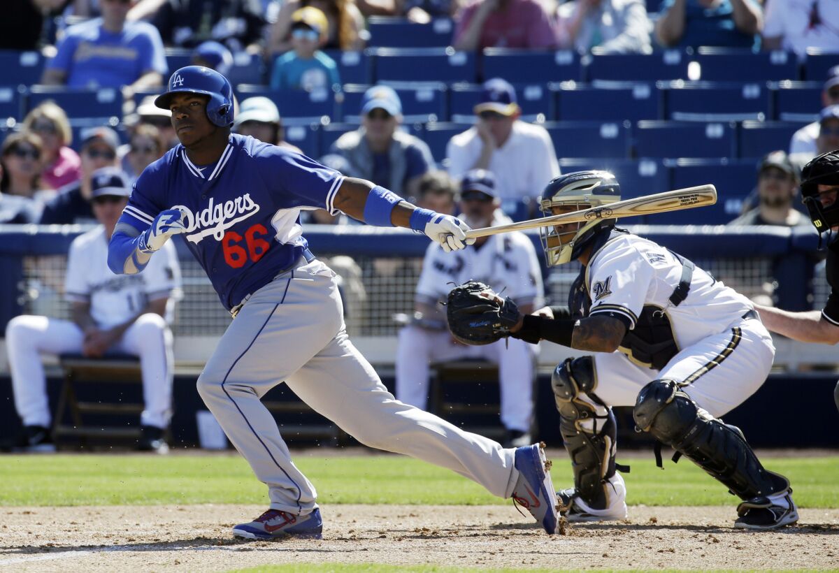 Dodgers outfielder Yasiel Puig hit his first home run of spring training against the Giants.