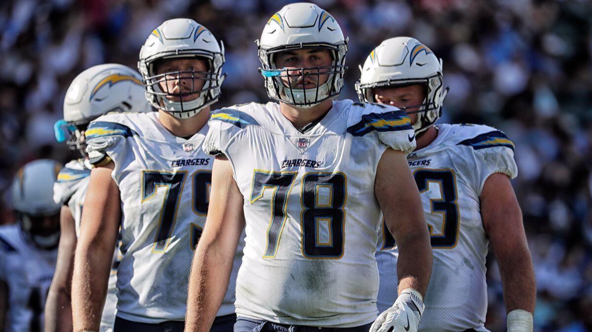 Chargers offensive linemen (left to right) Kenny Wiggins, Michael Schofield and Spencer Pulley on the field during action against the Chiefs at StubHub Center on Sept. 24.