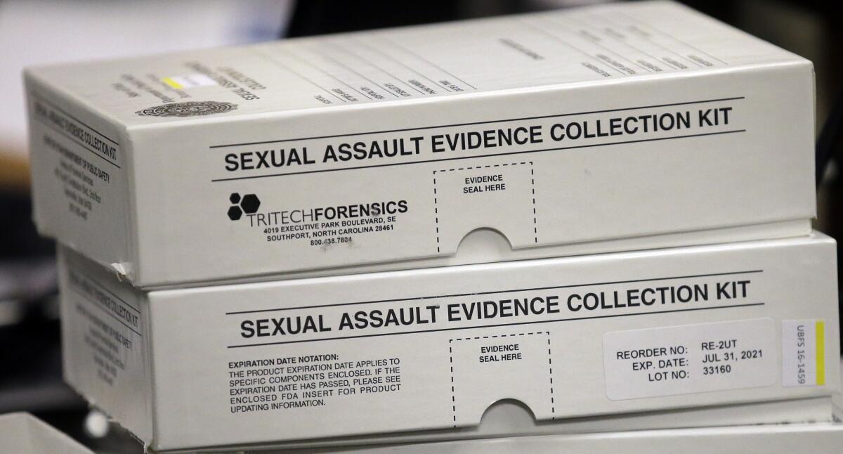 Two rape kit boxes stacked on a table