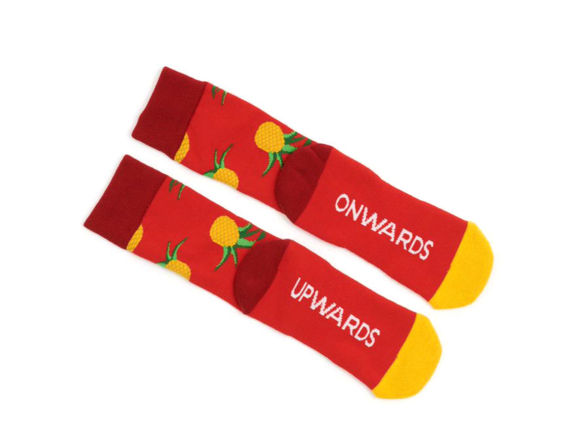A colorful pair of socks with pineapples and the words "onwards" and "upwards."