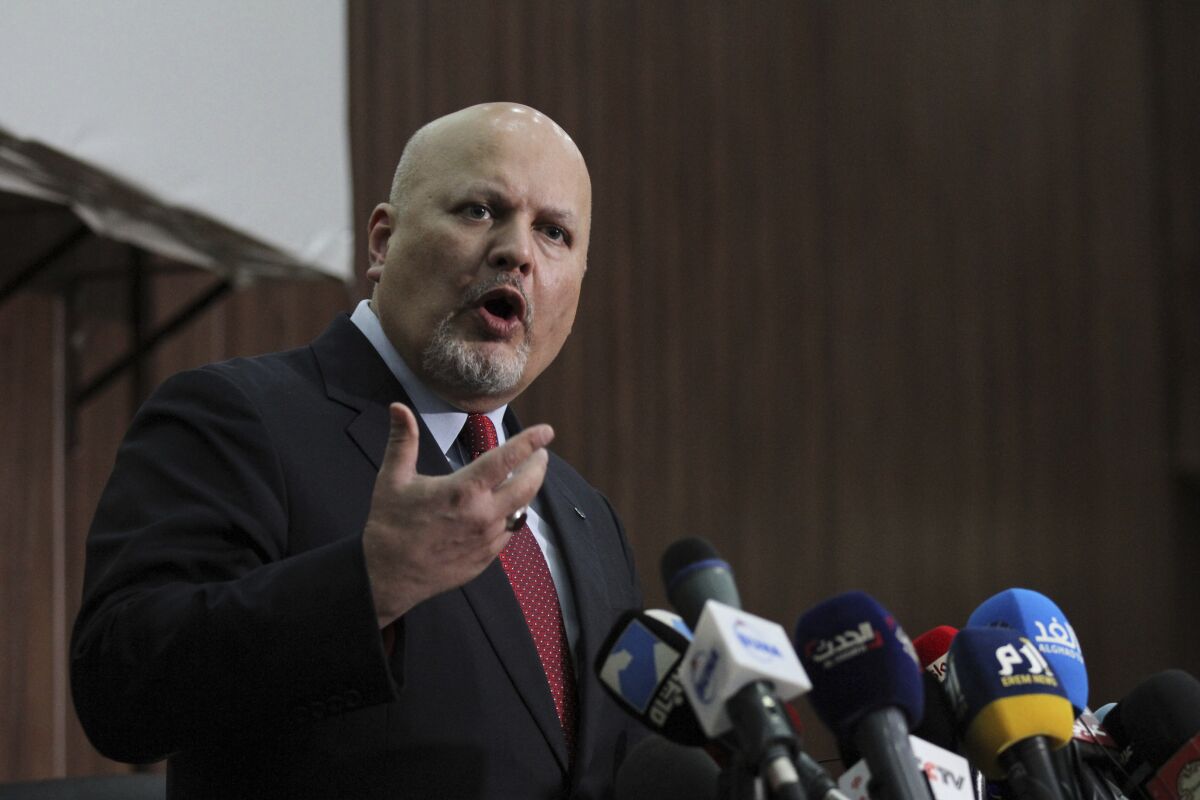FILE - In this Thursday Aug. 12, 2021 file photo, Karim Ahmed Khan, International Criminal Court chief prosecutor, speaks during a news conference at the Ministry of Justice in the Khartoum, Sudan. The chief prosecutor of the International Criminal Court sought urgent clearance Monday, Sept. 27 from the court's judges to resume investigations of war crimes and crimes against humanity in Afghanistan, saying that under the country's new Taliban rulers “there is no longer the prospect of genuine and effective domestic investigations” in the country. Judges at the global court authorized an investigation by Prosecutor Karim Khan's predecessor, Fatou Bensouda, in March last year. (AP Photo/Marwan Ali, file)