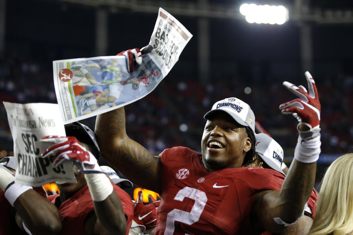 Alabama running back Derrick Henry celebrates with his team after defeating Florida in the SEC Championship at the Georgia Dome.