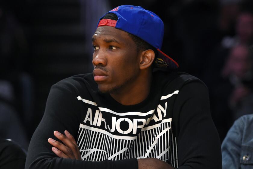 Kansas center Joel Embiid watches the Lakers play the Memphis Grizzlies at Staples Center in April.