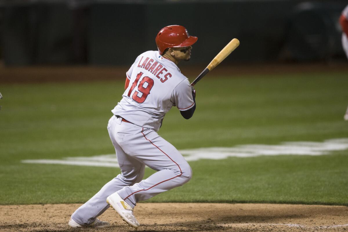 Juan Lagares hits a run-scoring single against the Oakland Athletics during the seventh inning Monday.