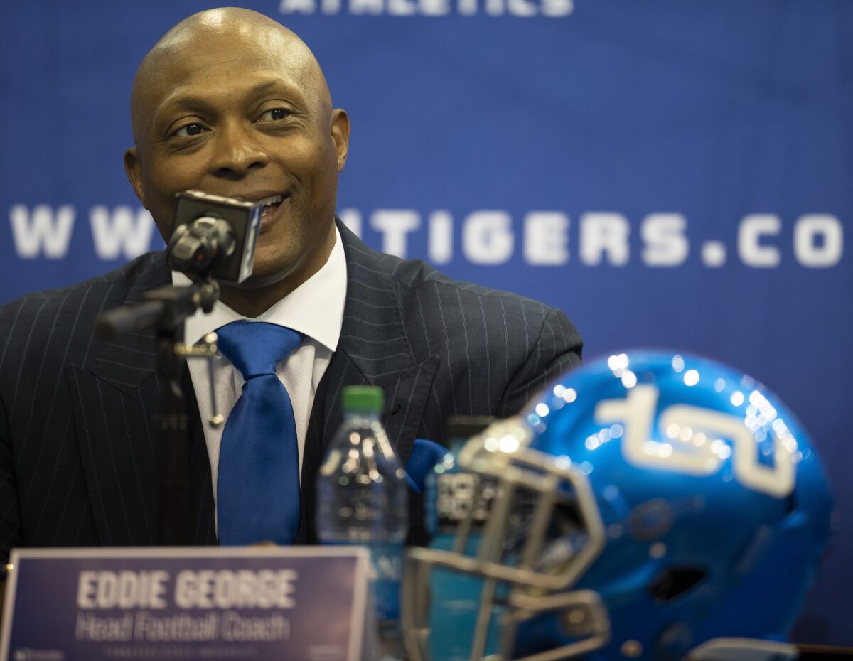 FILE - In this April 13, 2021, file photo, New Tennessee State University NCAA college football coach Eddie George smiles during a news conference in Nashville, Tenn.. George is one of several high-profile former pro athletes to take on athletic programs at black colleges and universities at a time when the country seems more than ready. (George Walker/The Tennessean via AP, File)