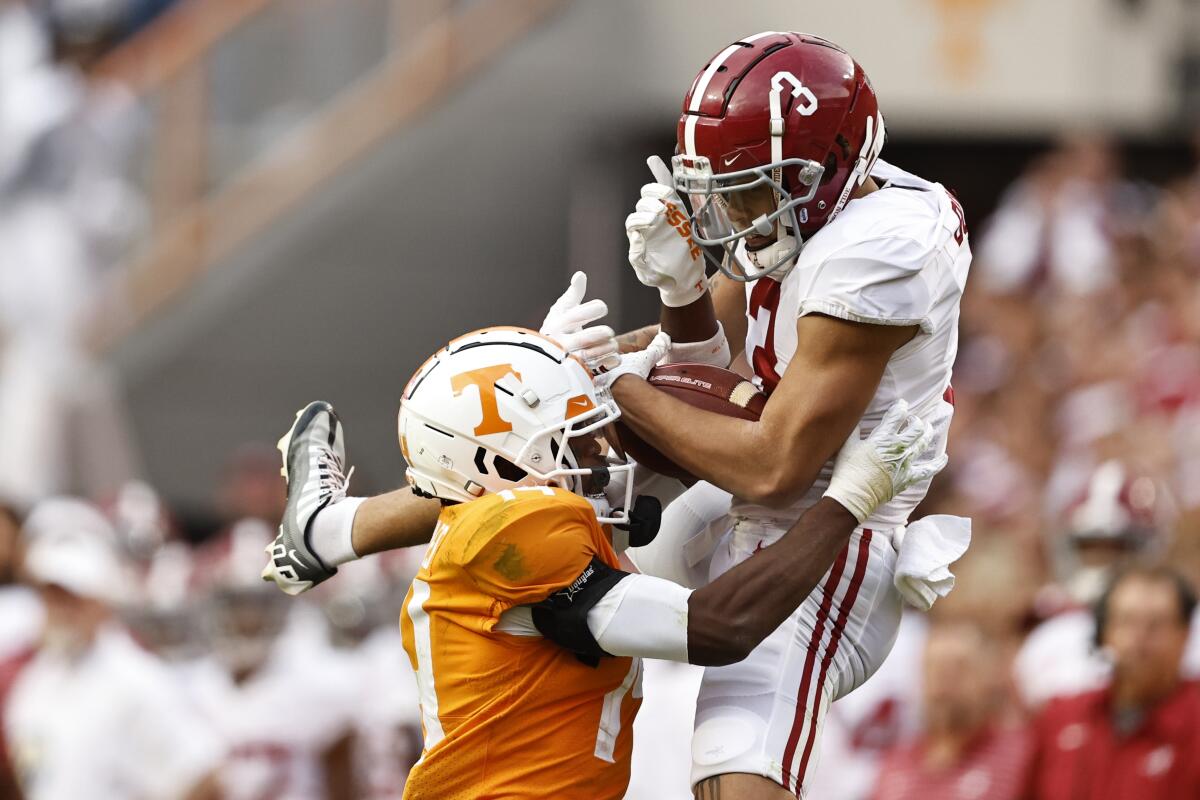  Jermaine Burton catches the ball for Alabama in the face of Tennessee's Christian Charles.
