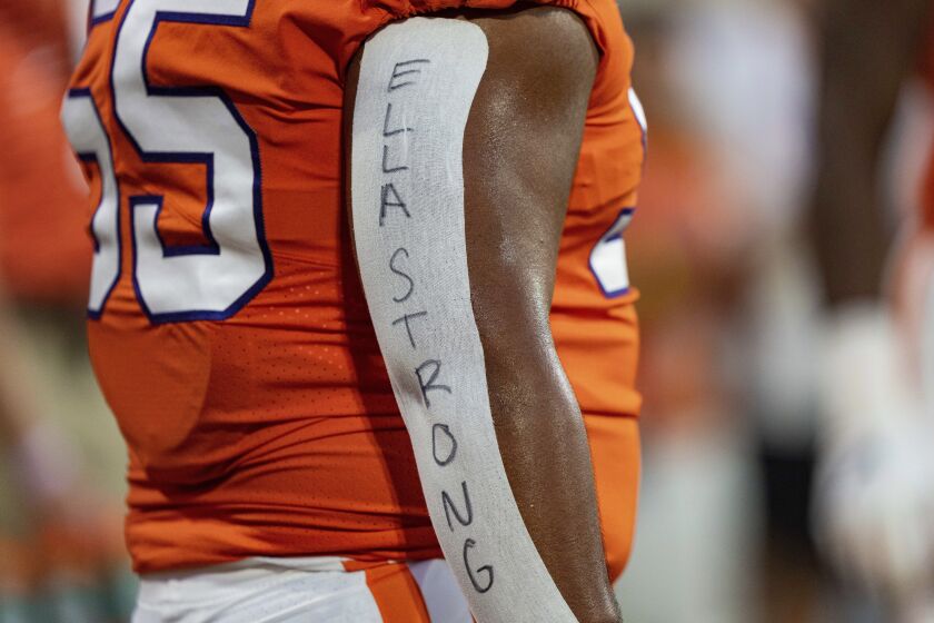 Clemson defensive tackle Payton Page honors Ella Bresee, sister of defensive tackle Bryan Bresee, during the team's NCAA college football game against Louisiana Tech on Saturday, Sept. 17, 2022, in Clemson, S.C. Ella Bresee died recently of brain cancer. (AP Photo/Jacob Kupferman)