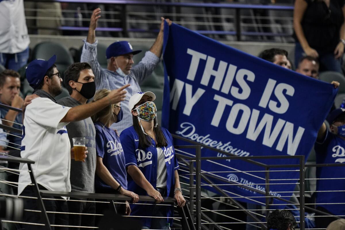 Dodgers fans root for their team in Game 1 of the World Series at Globe Life Field in Arlington, Texas.