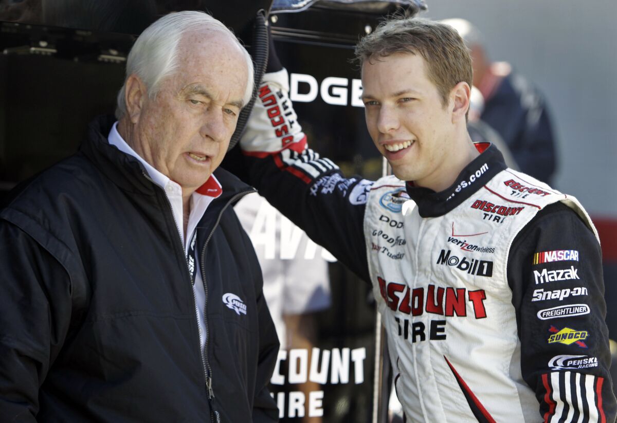 FILE - In this March 20, 2010, file photo, NASCAR driver Brad Keselowski, right, talks with team owner Roger Penske during practice for the NASCAR Sprint Cup series Food City 500 auto race at Bristol Motor Speedway in Bristol, Tenn. Heading into the race Sunday, Oct. 31, 2021, at Martinsville Speedway, Keselowski is in the final two races of his NASCAR career with Team Penske and would love nothing more than to close his 12-year run with another Cup championship. (AP Photo/Chuck Burton, File)