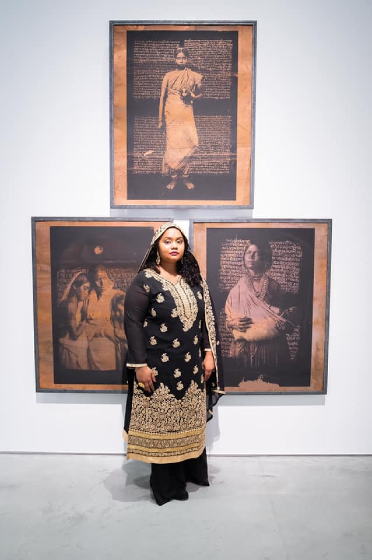 A woman in an intricate embroidered outfit and a head covering stands in front of three images of Indian women.