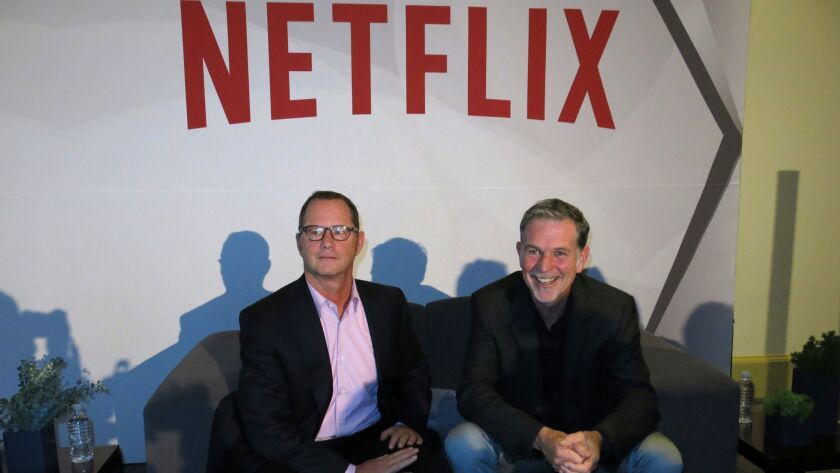 Netflix spokesman Jonathan Friedland, at left with CEO Reed Hastings, was fired after two incidents in which he used the N-word. Friedland apologized Friday on Twitter.
