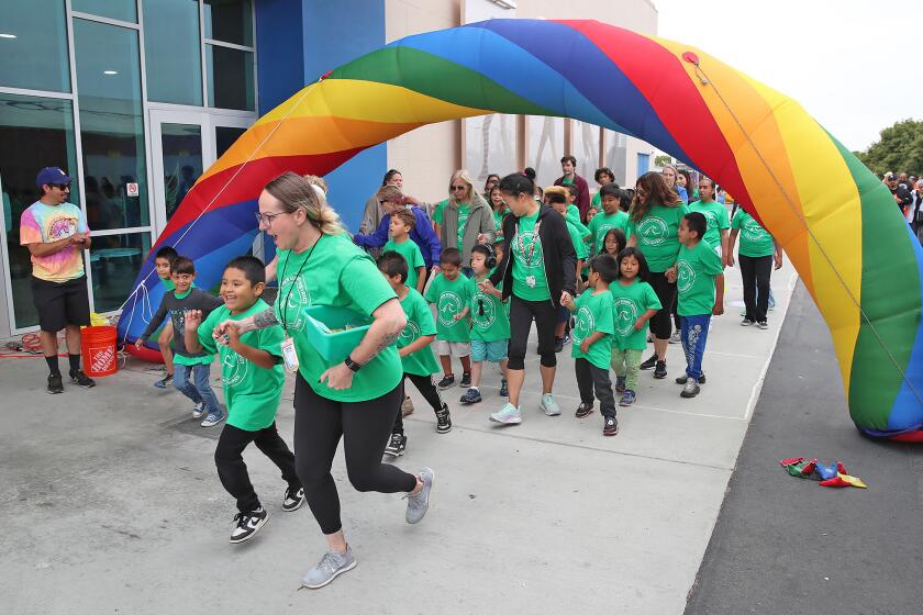 Participants of the younger Oak View School olympic team parade under the welcome arch during the Ocean View School District's 33rd annual Special Olympics at Oak View Elementary on Friday.