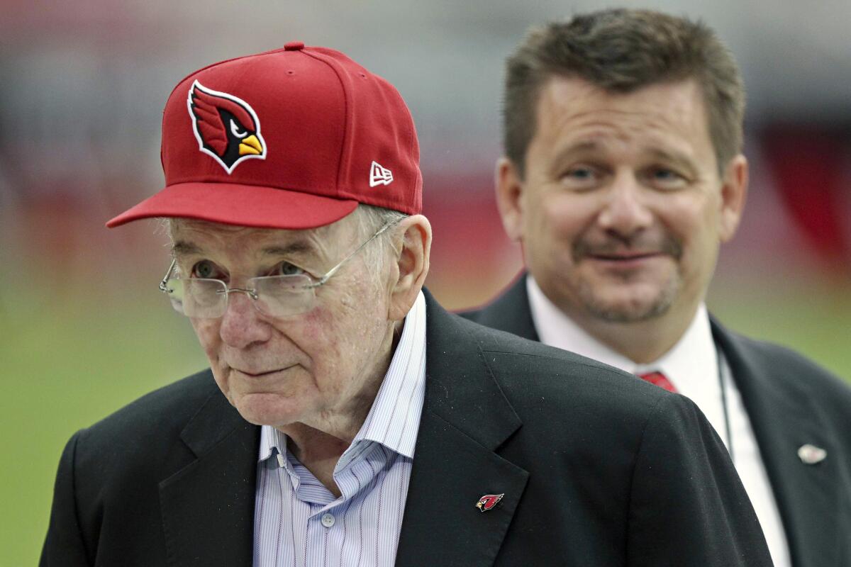 Bill Bidwill, front, and his son Michael 