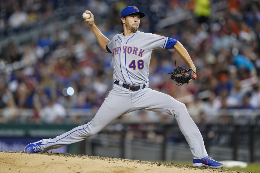 New York Mets starting pitcher Jacob deGrom throws during the fifth inning of a baseball game against the Washington Nationals at Nationals Park, Tuesday, Aug. 2, 2022, in Washington. (AP Photo/Alex Brandon)