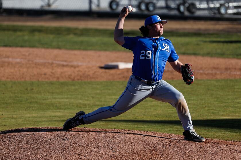 San Marcos, CA - March 09: Rancho Bernardo's Tyler Arnold pitches against Mission Hills during their game at the school on Thursday, March 9, 2023 in San Marcos, CA. (Meg McLaughlin / The San Diego Union-Tribune)