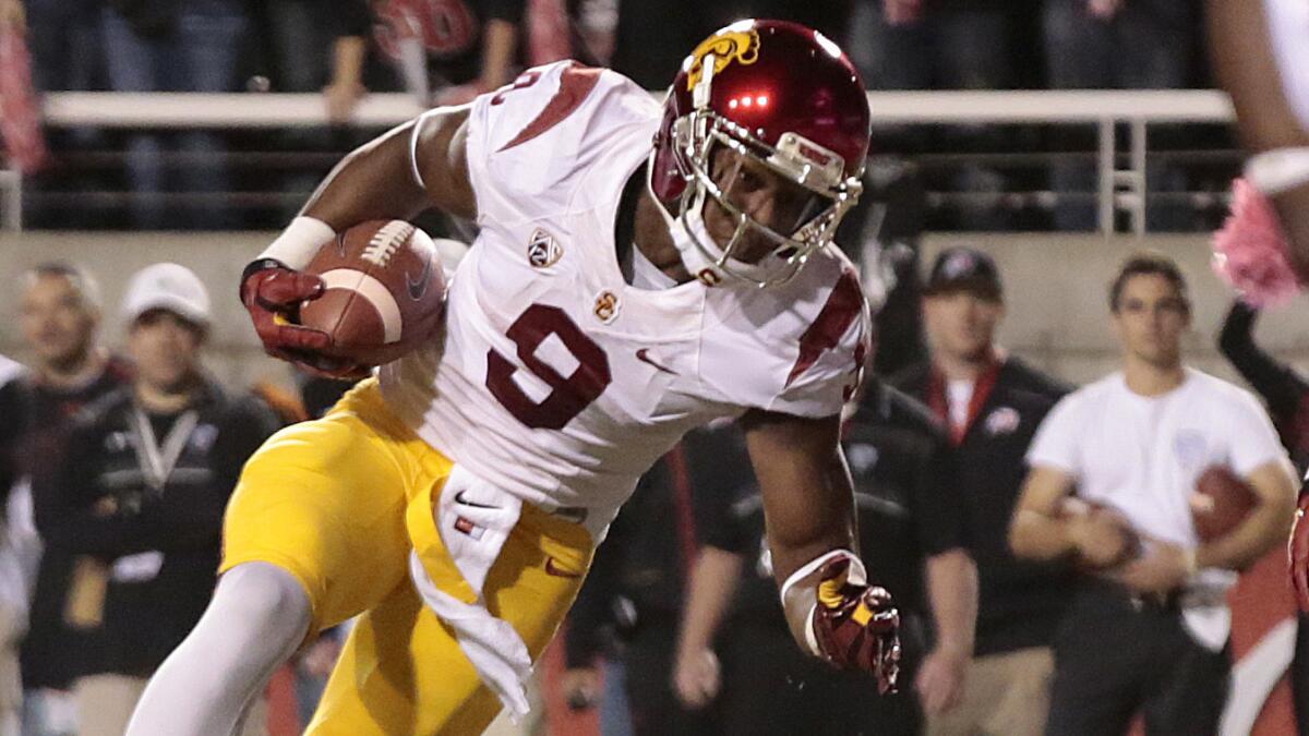 USC wide receiver JuJu Smith stumbles into the end zone to score a touchdown against Utah on Oct. 25, 2014. Smith is poised to be one of the Trojans' top receivers next season.