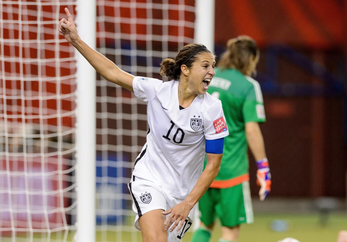 Carli Lloyd reacts after assisting on Kelley O'Hara's goal in the second half against Germany during a semifinal match of the Women's World Cup on June 30, 2015.