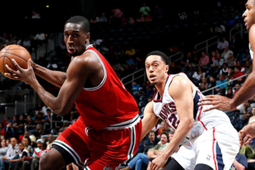 Ekpe Udoh, at the time with the Milwaukee Bucks, drives against the Atlanta Hawks during a game.