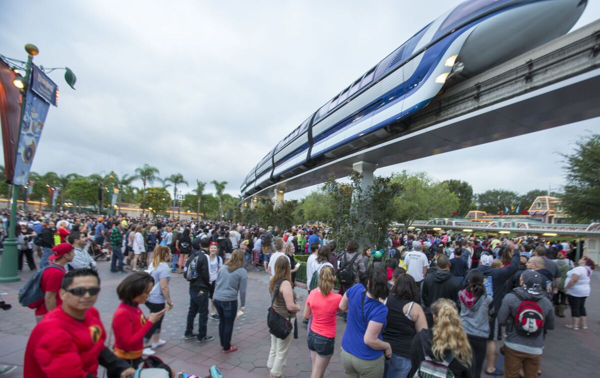 Thousands gathered outside the Disneyland Resort on Friday, May 23, 2014, in Anaheim, Calif.