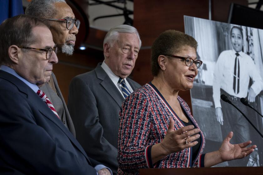 From left, House Judiciary Committee Chairman Jerrold Nadler, D-N.Y., Rep. Bobby Rush, D-Ill., House Majority Leader Steny Hoyer, D-Md., and Rep. Karen Bass, D-Calif., chair of the Congressional Black Caucus, hold a news conference to discuss the "Emmett Till Antilynching Act" which would designate lynching as a hate crime under federal law, on Capitol Hill in Washington, Wednesday, Feb. 26, 2020. Emmett Till, pictured at right, was a 14-year-old African-American who was lynched in Mississippi in 1955, after being accused of offending a white woman in her family's grocery store. (AP Photo/J. Scott Applewhite)