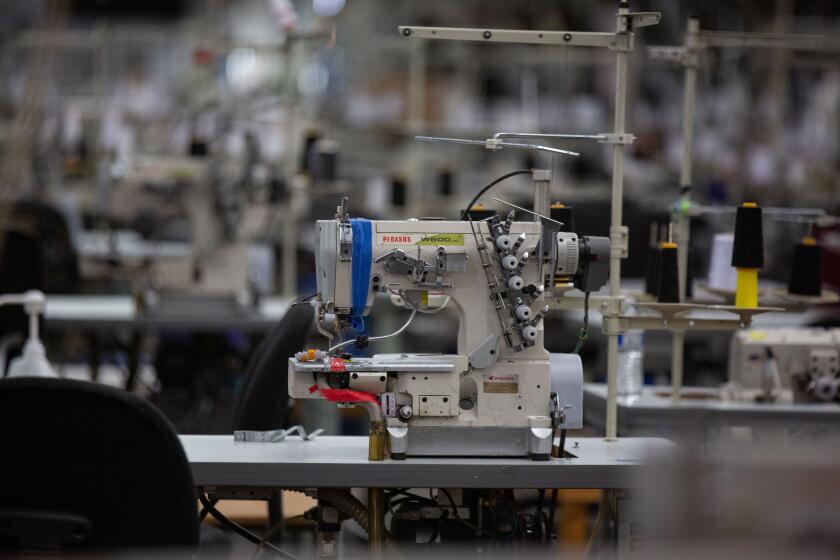 LOS ANGELES, CA - JULY 15: LA Apparel holds a health and safety training session for its employees after operations at the clothing factory were shutdown by city officials due to a huge coronavirus outbreak on Wednesday, July 15, 2020 in Los Angeles, CA. (Jason Armond / Los Angeles Times)