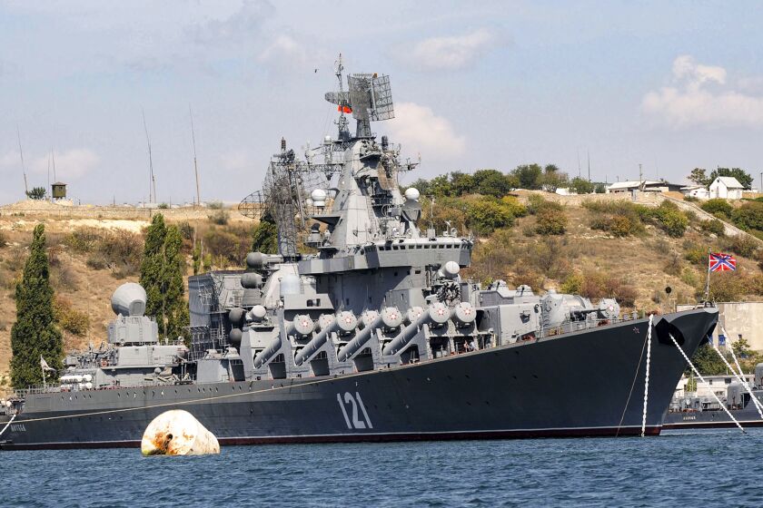 FILE - The Russian missile cruiser Moskva, the flagship of Russia's Black Sea Fleet is seen anchored in the Black Sea port of Sevastopol, on Sept. 11, 2008. The Russian Defense Ministry confirmed the ship was damaged Wednesday, April 13, 2022, but not that it was hit by Ukraine. The Ministry says ammunition on board detonated as a result of a fire whose causes "were being established," and the Moskva's entire crew was evacuated.(AP Photo, File)