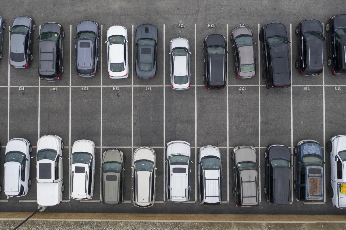 An aerial view shows cars parked for a drive-in Easter church service at New Harvest church