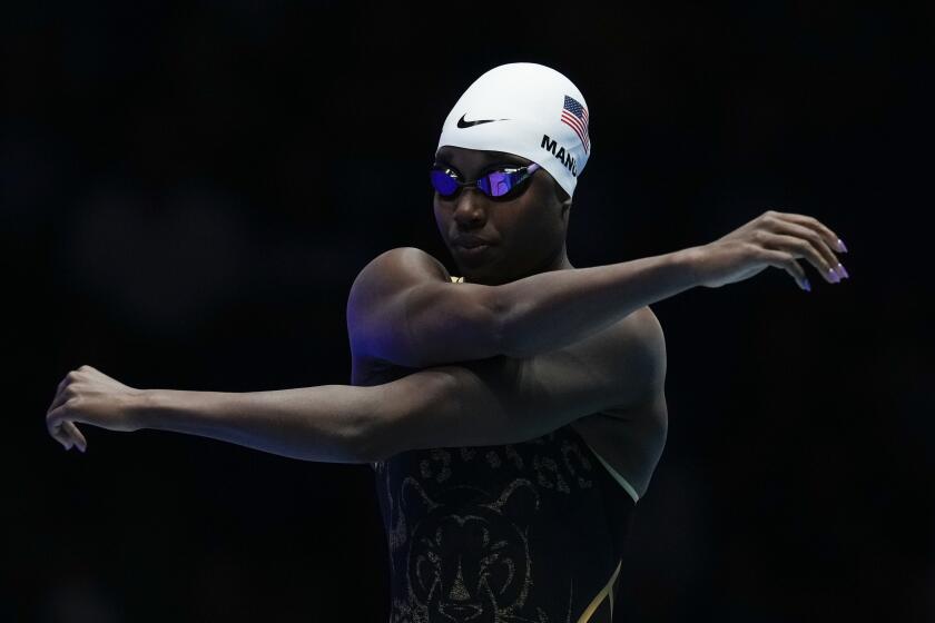 Simone Manuel stretches before a Women's 100 freestyle semifinals heat Tuesday.