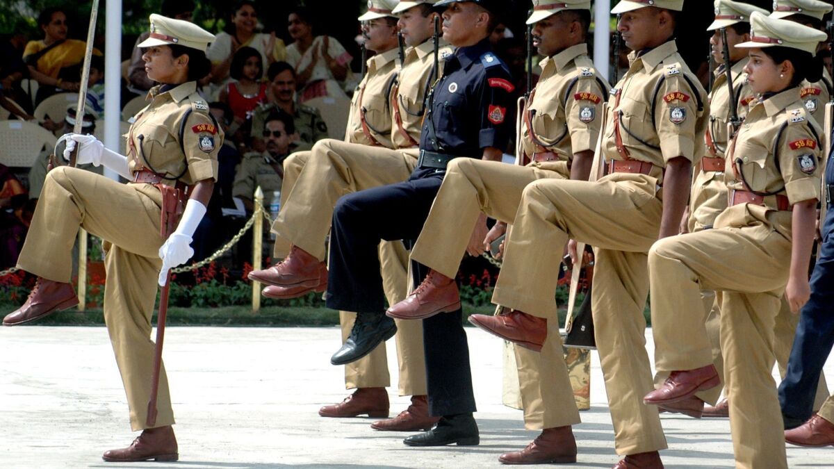 Indian police officers march in a ceremony at the national police academy.