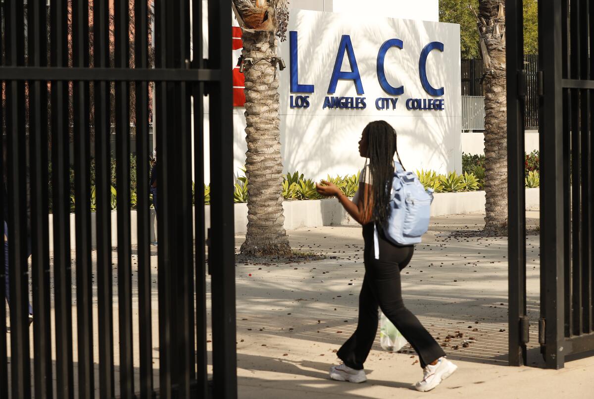 A woman walks on the Los Angeles City College campus.