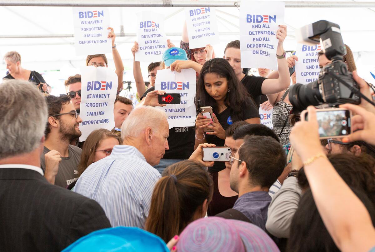 Protesters surround Joe Biden after he made a campaign stop in Dover, N.H.