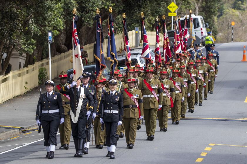 Members of New Zealand’s armed services participate in the State Memorial Service honoring Queen Elizabeth II at the Cathedral of St Paul in Wellington New Zealand, Monday, Sept. 26, 2022. New Zealand on Monday commemorated Queen Elizabeth II with a public holiday, a minute of silence and an official memorial service. (Mark Mitchell/New Zealand Herald via AP)